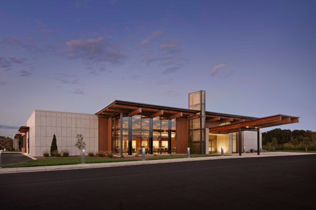 River Valley Health’s new medical office building, designed in partnership with JAI, reflects a powerful commitment to whole-person care.
The state-of-the-art facility brings primary care, dental, behavioral health, pharmacy, and urgent care together under one sustainably built roof. Inspired by its East Tennessee surroundings, the design features timber-wrapped structural elements, exposed tongue-and-groove ceilings, and a composite wood rainscreen crafted from recycled materials.
Inside, soaring volumes, floor-to-ceiling glass, clerestory daylight, and geothermal systems work together to create a calming, energy-efficient environment that supports healing and connection to nature.
LED lighting, Low-E glazing, and thoughtful material selections further enhance comfort, performance, and long-term sustainability.
“River Valley Health is providing holistic, comprehensive care to the community. We have a covenant with this community to provide access to care. This building is what the community deserves.” — Parinda Khatri, CEO
#Architecture #DesignWithPurpose #HealthcareDesign #SustainableDesign #WholePersonCare #EastTennessee #JAIArchitecture
Interior 📸: @benfinch
Exterior 📸: Mountain Photographics